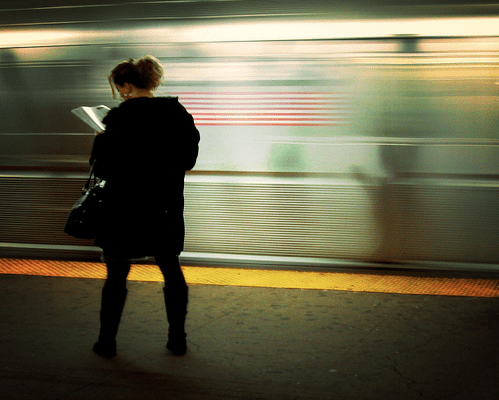 On the platform, reading Flickr user: Mo Riza/ CC by 2.0