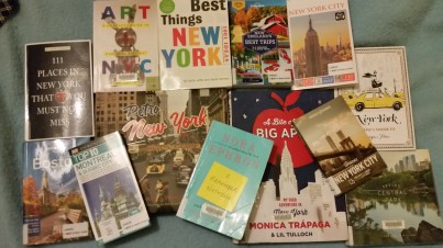 Travel books scattered.