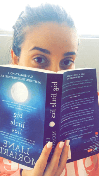 Elessa holding Liane Moriarty's Big Little Lies in front of her face