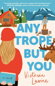 A cartoon cover. Bright reds against mountain white with peaks, a moose and a he-bro chopping down a tree stump. A cottage in the background.